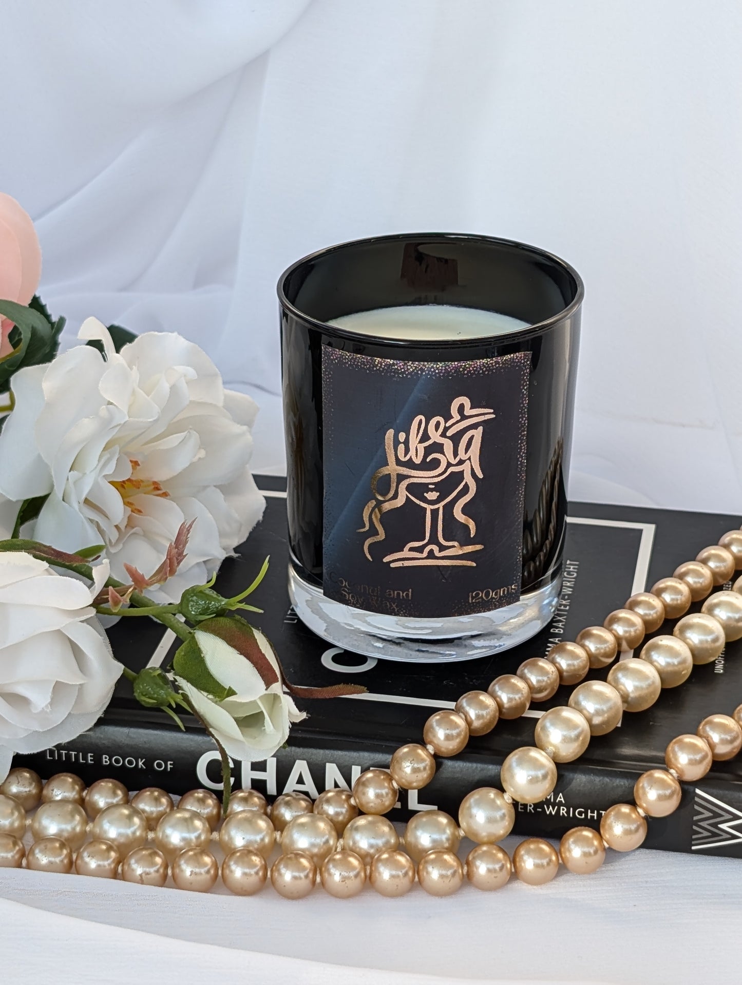 Top view of Libra black and gold zodiac candle