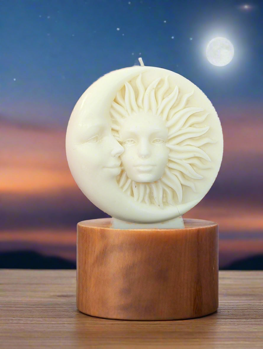 Celestial sun and moon candle on a plinth against the night sky