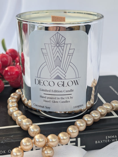 Art Deco Glow candle with decorative pearls and a book in the background