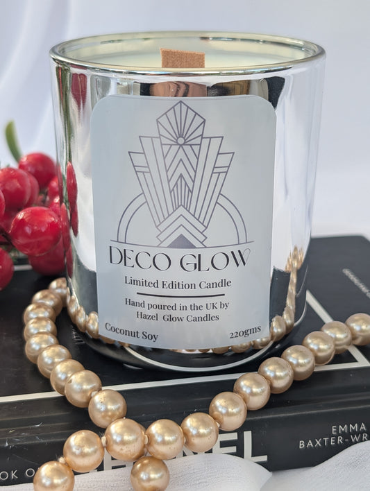 Art Deco Glow candle with decorative pearls and a book in the background