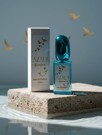 Azadi vegan refillable perfume by Hazel Glow on stone plinth in water