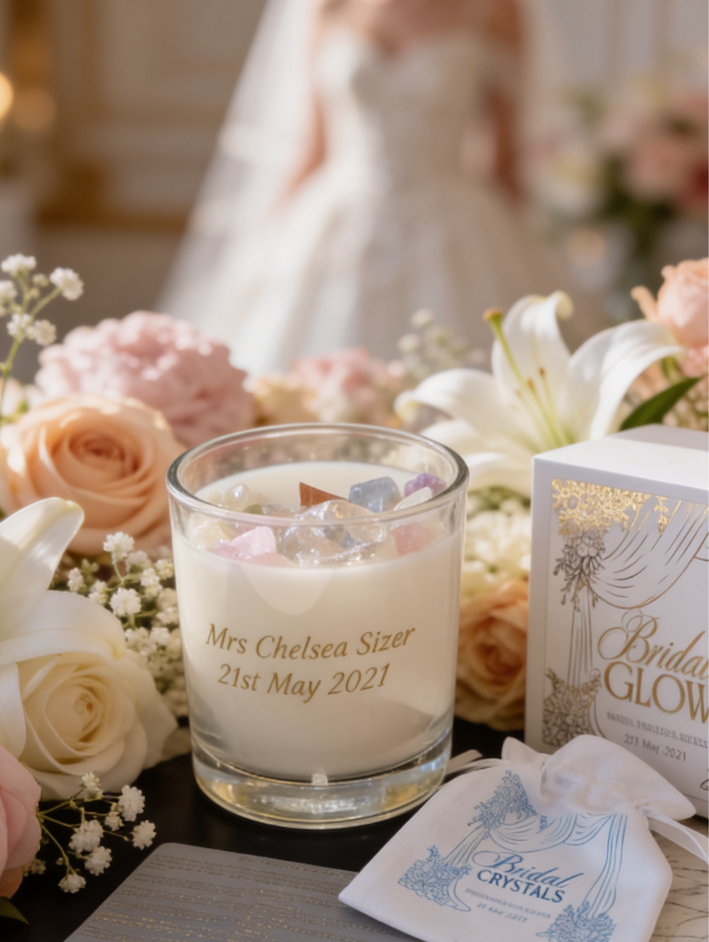 Bridal Candle with personalised message, flowers, and a card on a table with a blurred background of a bride.