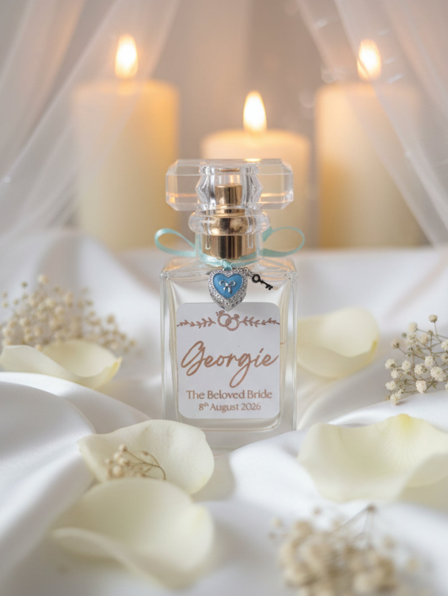 Bride's perfume - personalised wedding  'Georgie The Beloved Bride 8th August 2026', nestled in white shredded paper inside a gift box.