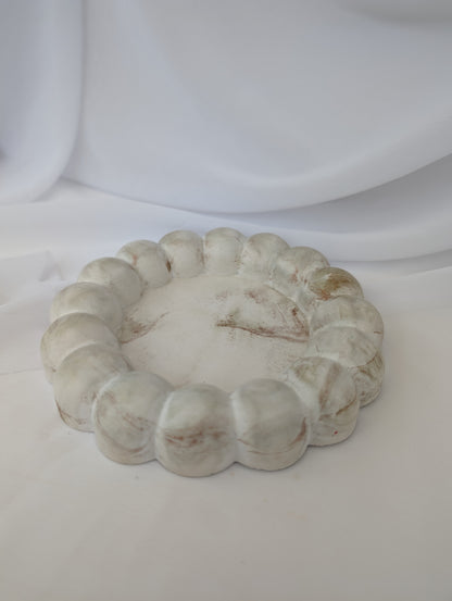 Decorative stone effect bubble trinket tray on a white background