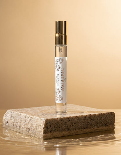 Vegan perfume, discovery size Chantresse perfume on stone surface against a beige background