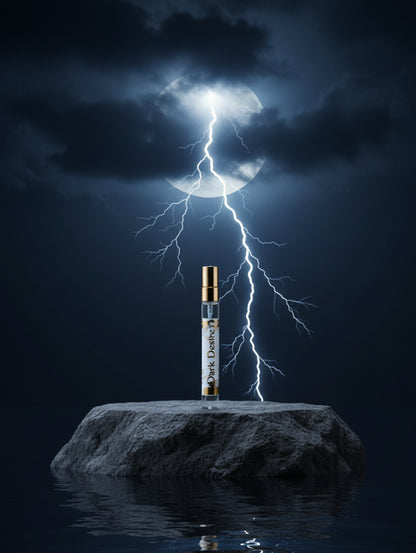 Dark Desire eau de parfum 10ml by Hazel Glow on stone with lightning