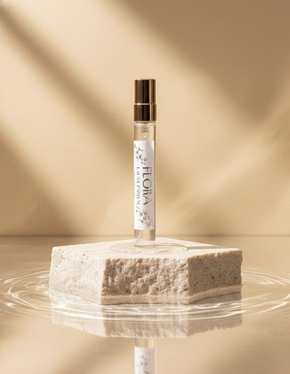 Flora vegan eau de parfum 10ml on a stone plinth