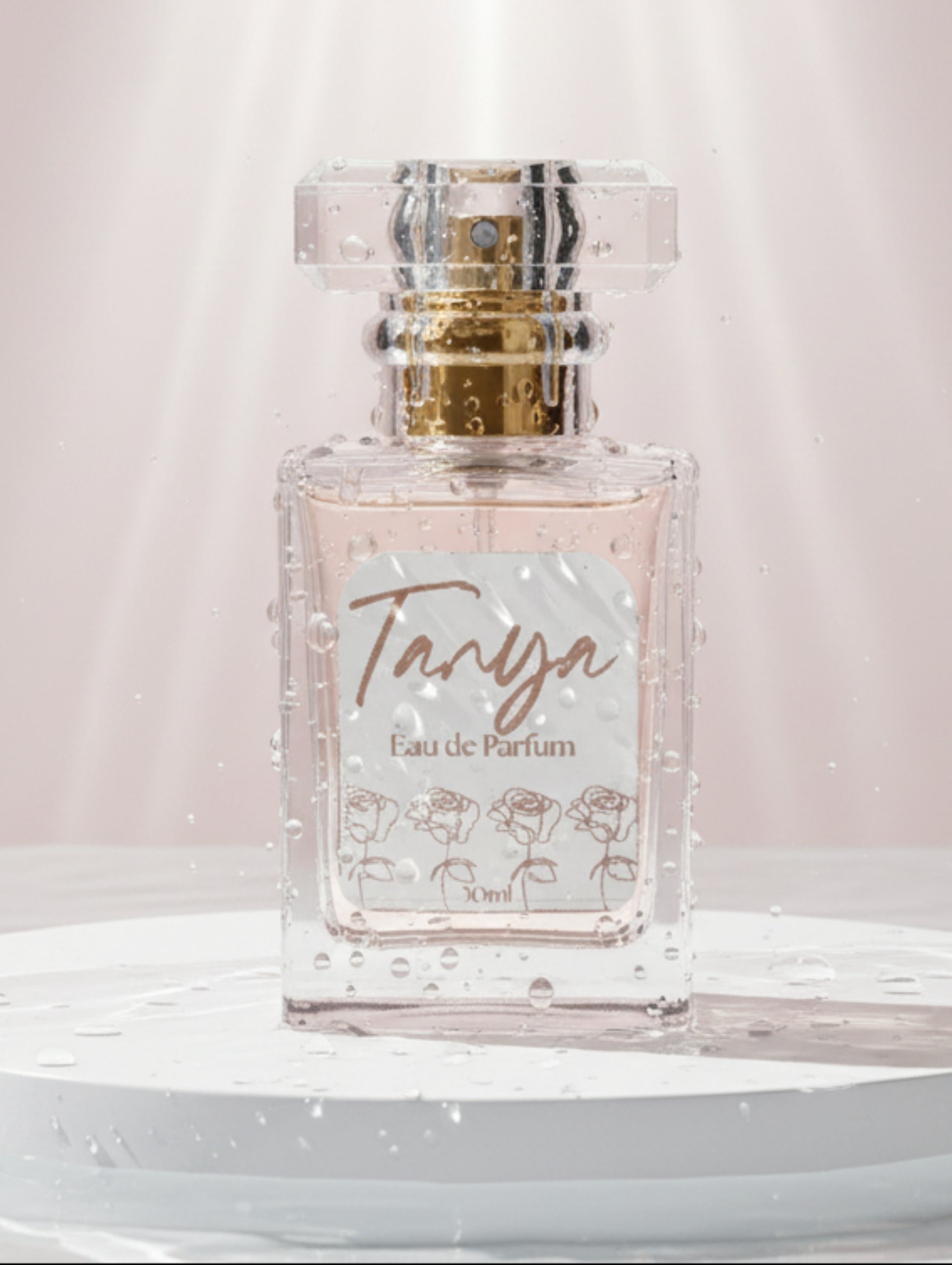 Personalised Perfume bottle labeled 'Tanya' with floral foiled label on a white background