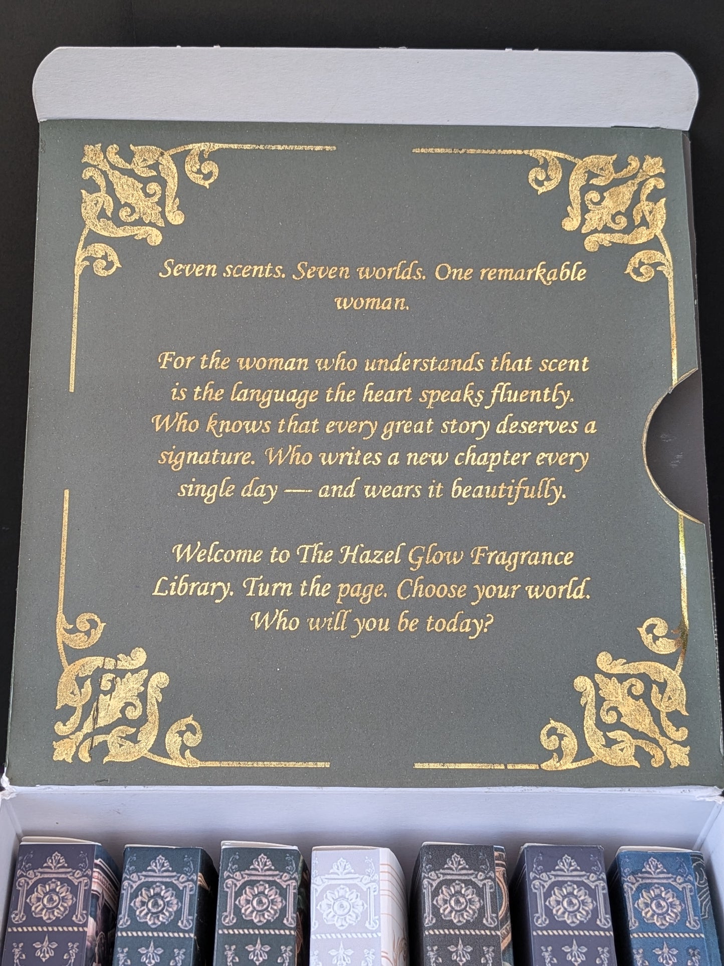 Inside inner lid green and gold foiled message of the Hazel Glow Library
