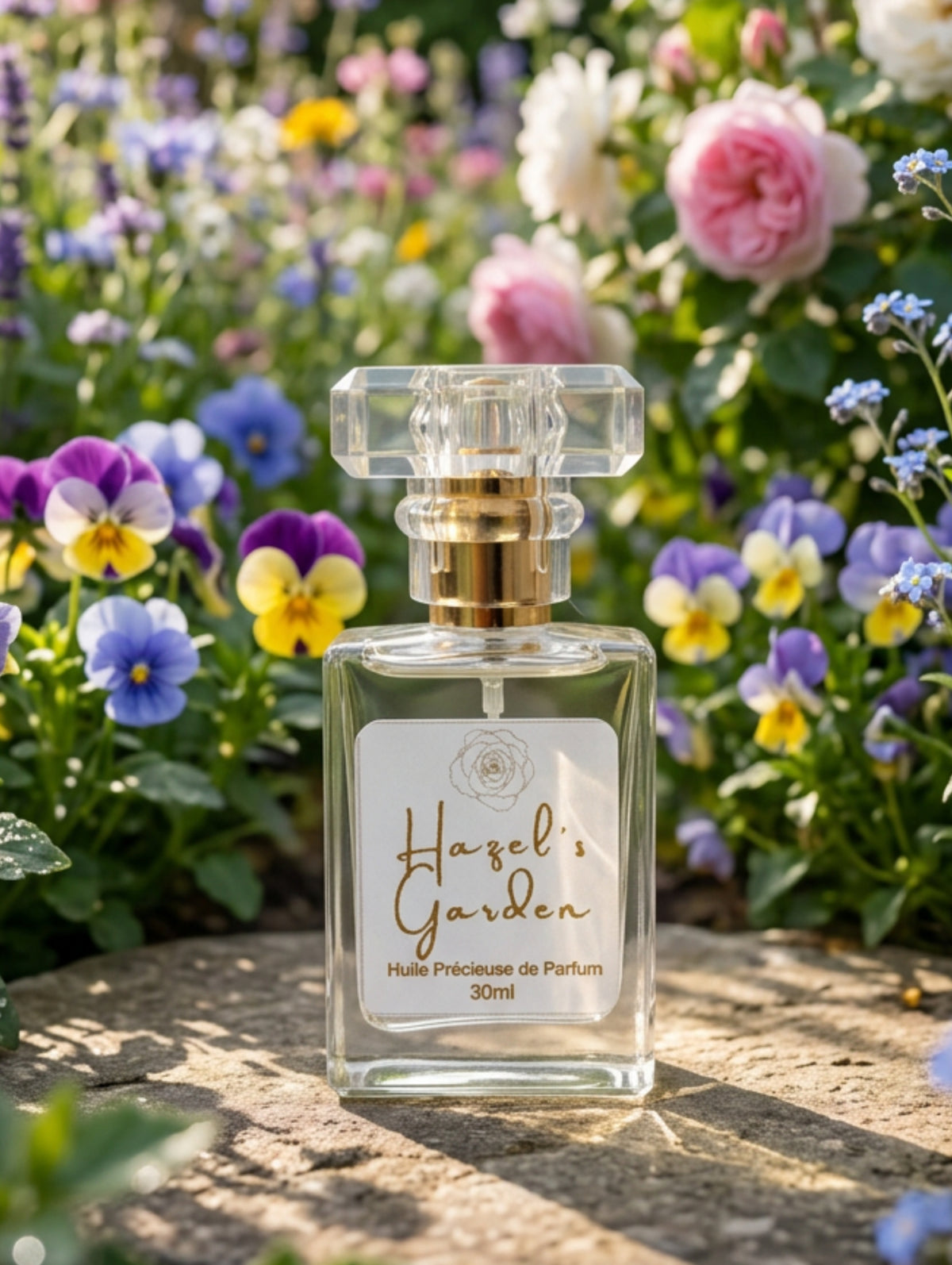 Hazel's Garden precious perfume oil spray by Hazel Glow.  In a clear rectangular glass bottle with faceted lid.  