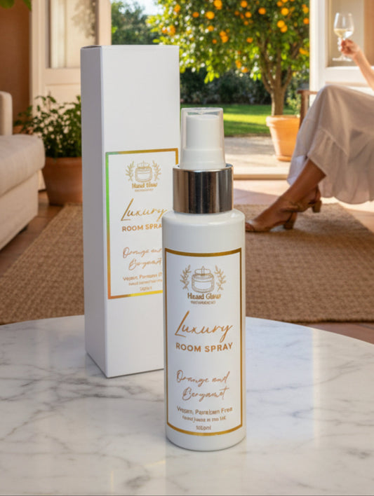 A bottle of 'Luxury' Orange and Bergamot Room Spray by 'Head Glow  .