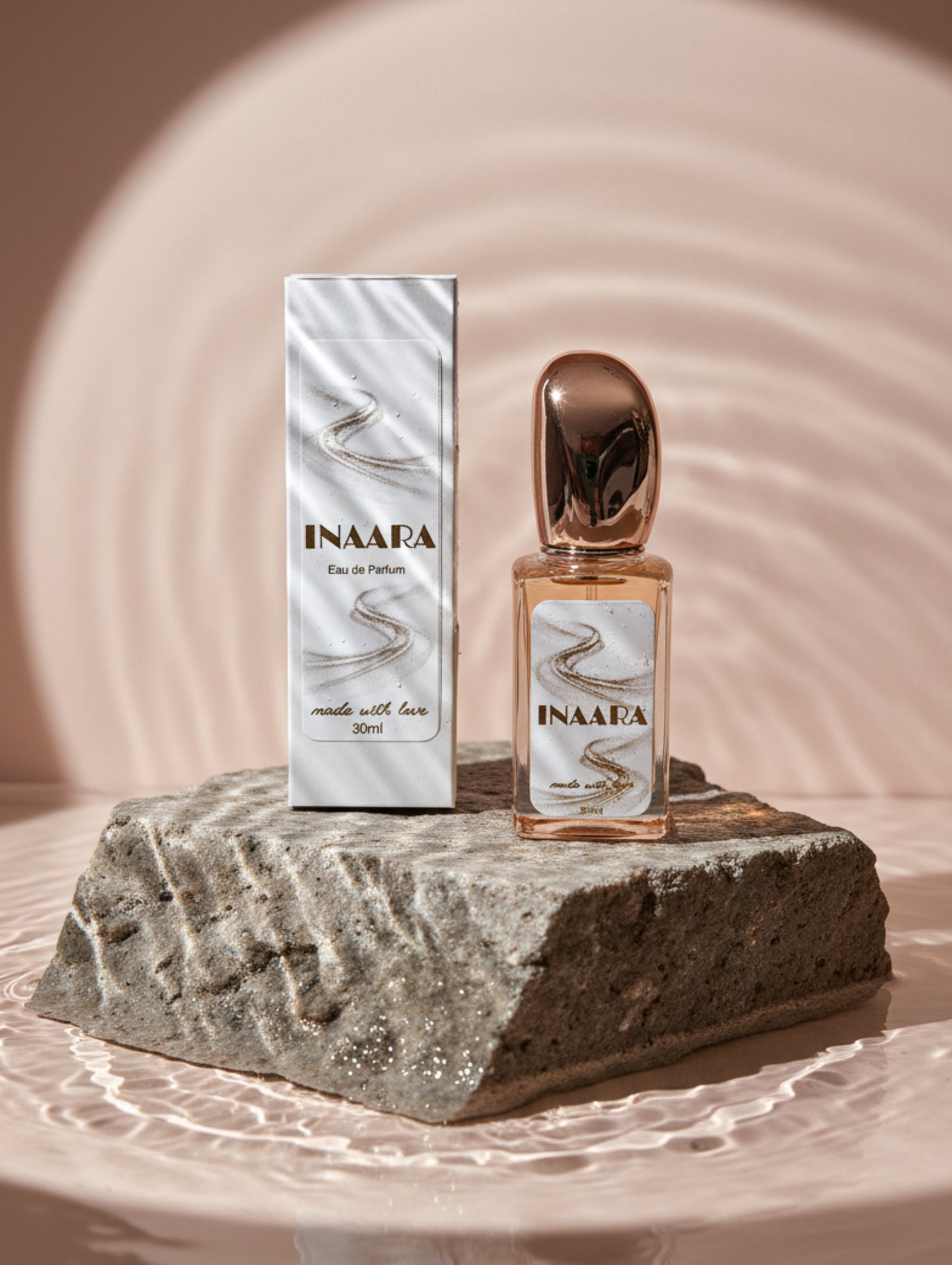 Vegan Perfume Inaara by Hazel Glow on stone plinth in water