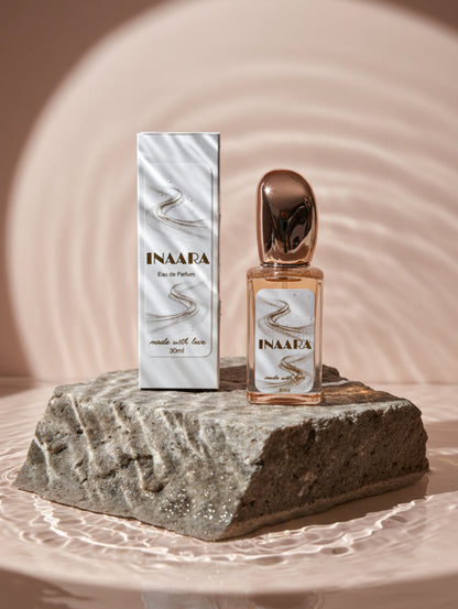 Vegan Perfume Inaara by Hazel Glow on stone plinth in water
