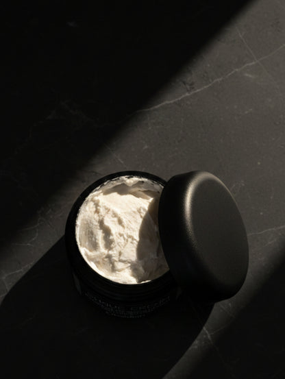 Open Jar of Obsidian Shave Cream on black marble background