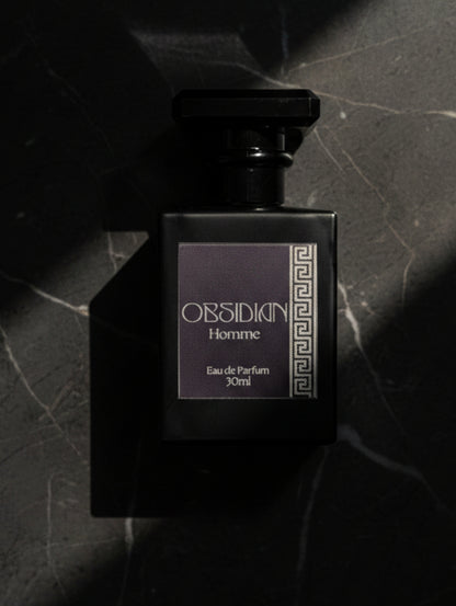Obsidian Fragrance for Men by Hazel Glow, Black bottle with silver foiled label on black marble