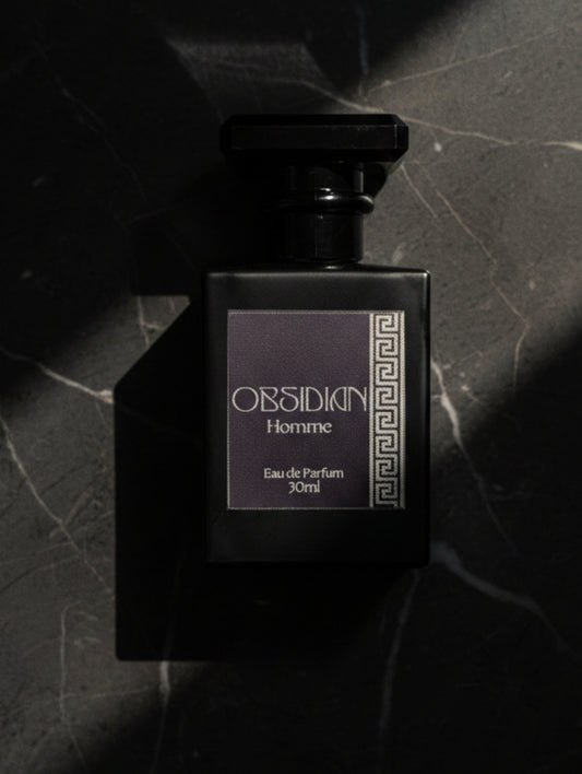 Obsidian Fragrance for Men by Hazel Glow, Black bottle with silver foiled label on black marble