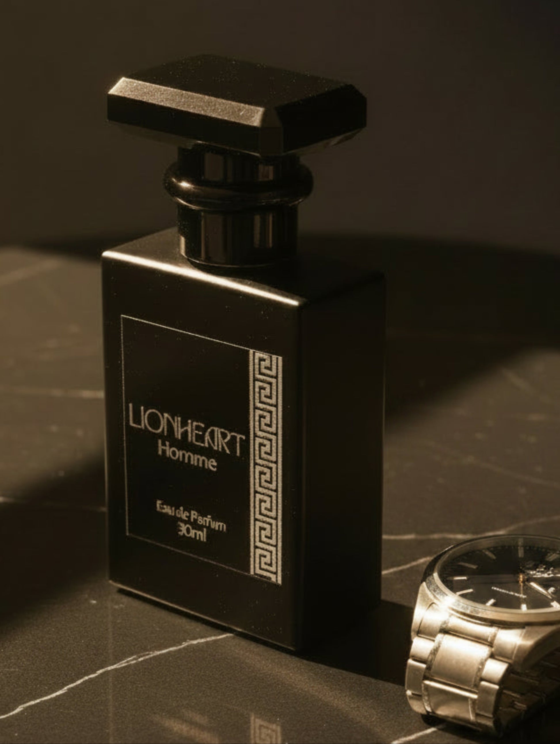 A 30ml bottle of Lionheart Homme Eau de Parfum, featuring a matte black rectangular bottle with a faceted black cap and a dark label with silver foil text and a Greek key pattern.