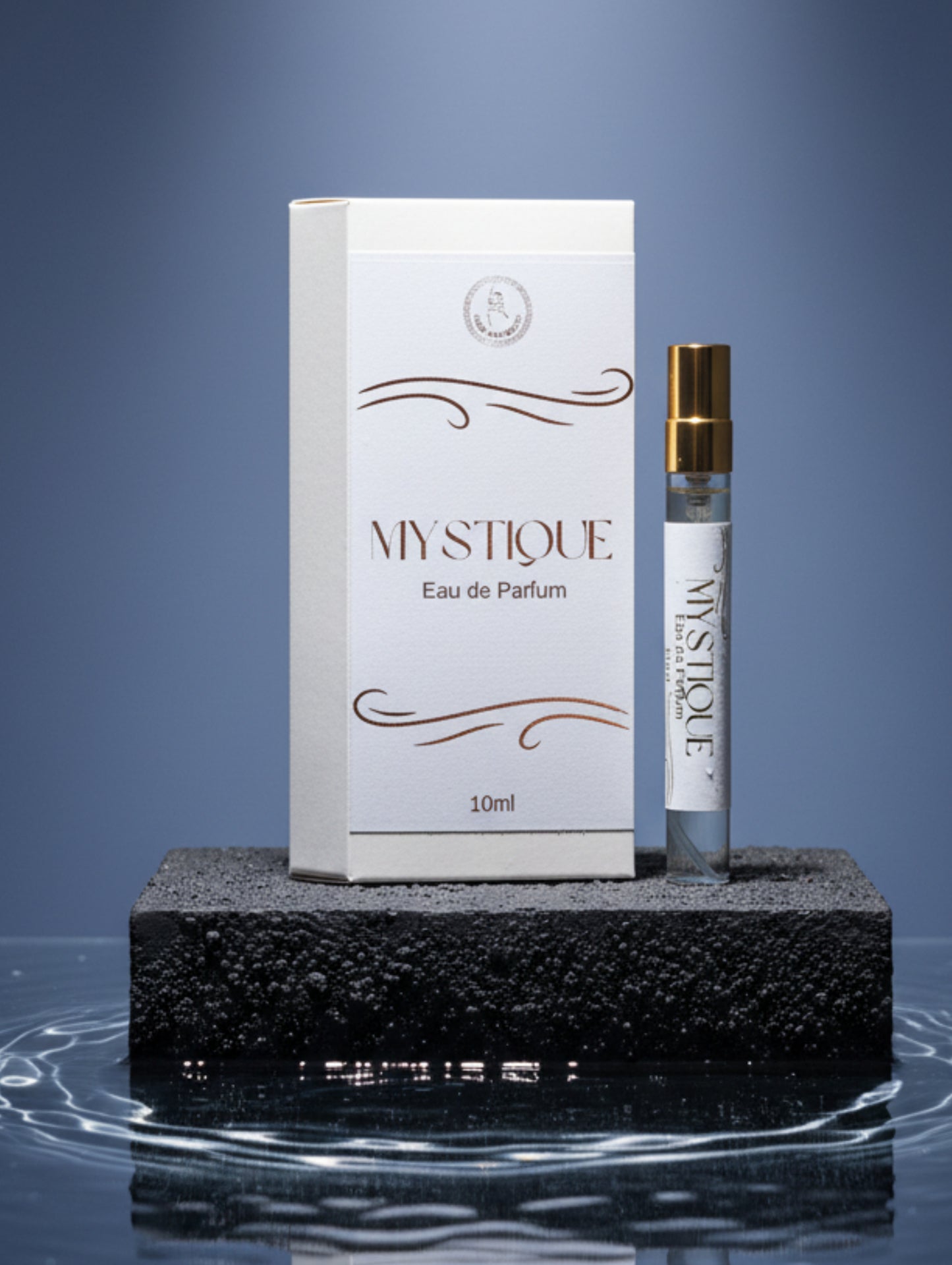 Mystique Eau de Parfum bottle and packaging on a surface with decorative items.