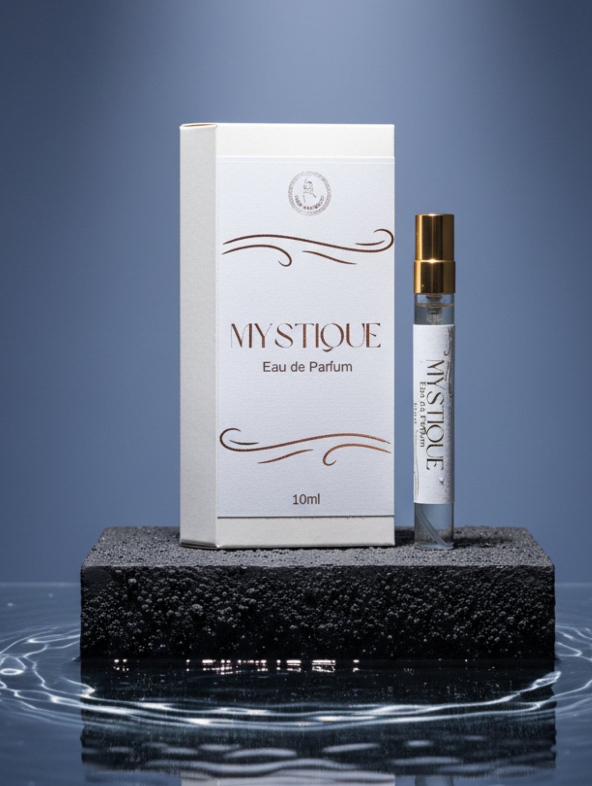 Mystique Eau de Parfum bottle and packaging on a surface with decorative items.