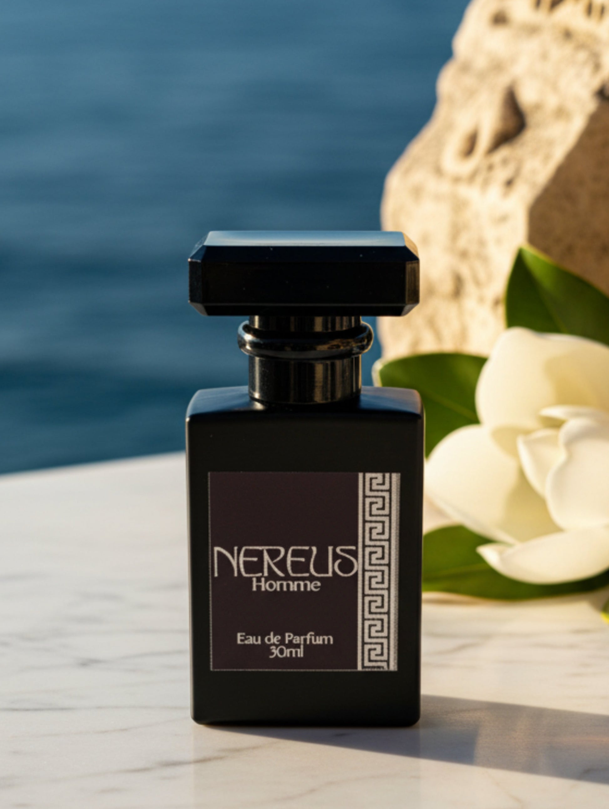 Men's eau de parfum Nereus by Hazel Glow.  Black matte glass bottle with black label and silver foil detail