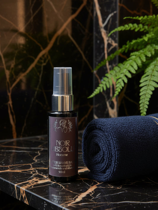 Post Shave balm with botanical oils, niacinamide and allantoin by Hazel Glow.  50ml black bottle with silver foil label