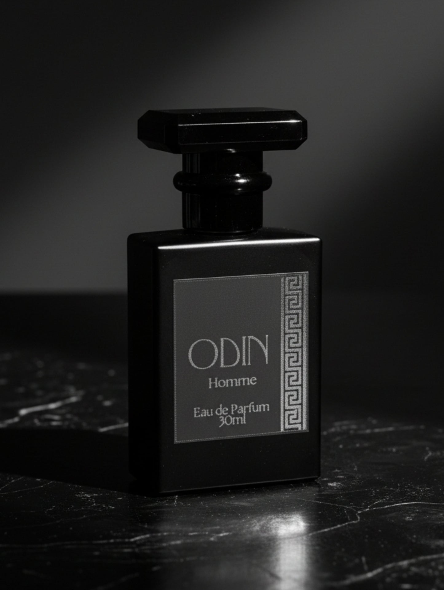 Odin men's perfume by Hazel Glow.  Black perfume bottle with black label and silver foil design