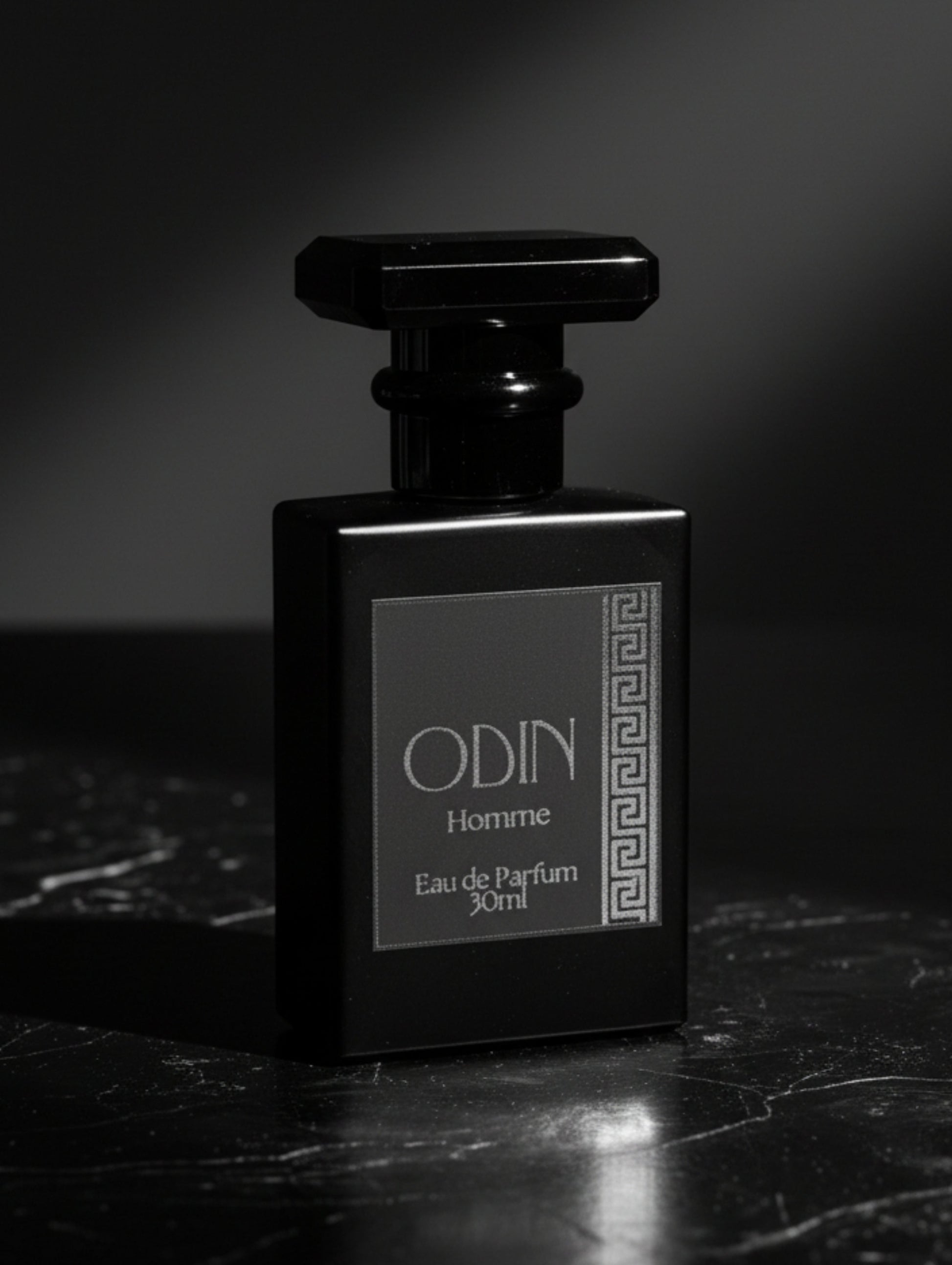 Odin men's perfume by Hazel Glow.  Black perfume bottle with black label and silver foil design