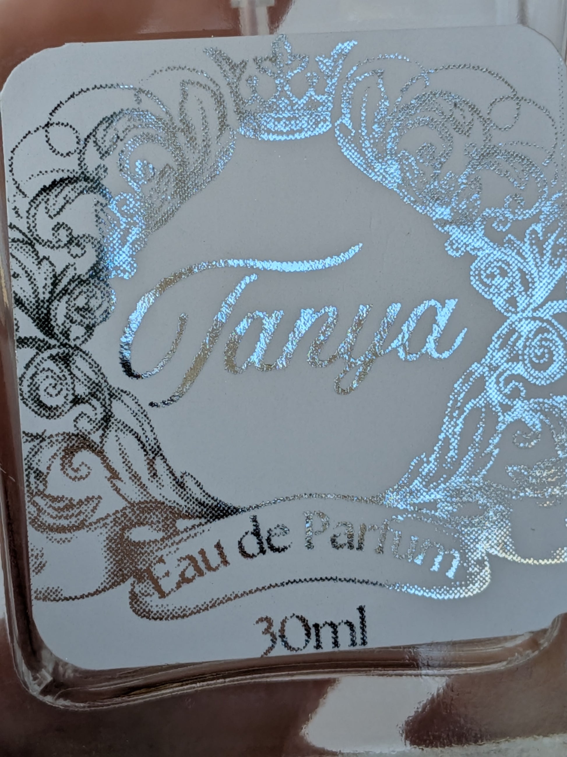 Close up detail of ornate personalised perfume bottle label