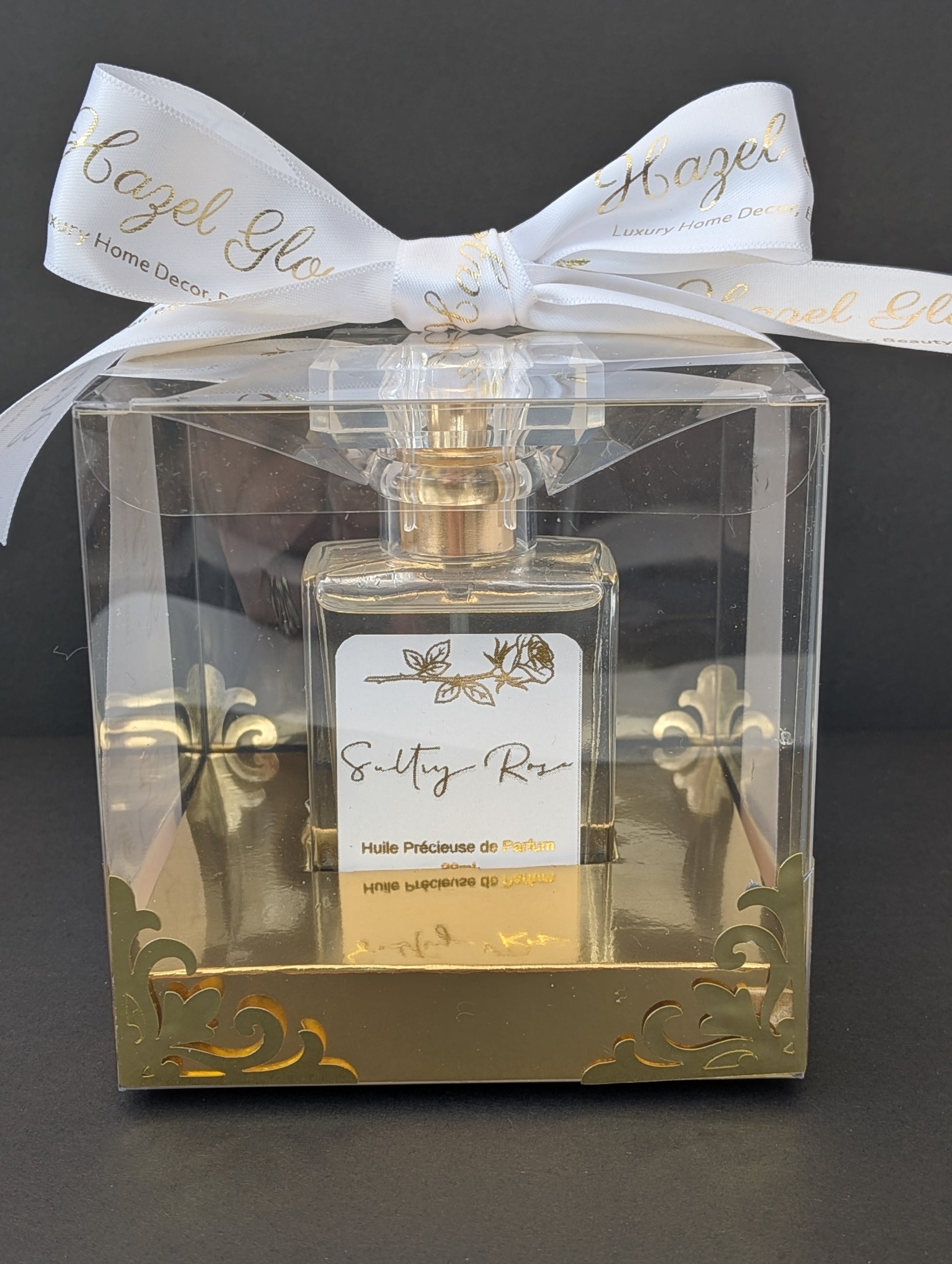Perfume Oil Sultry Rose by Hazel Glow in clear box with gold accents