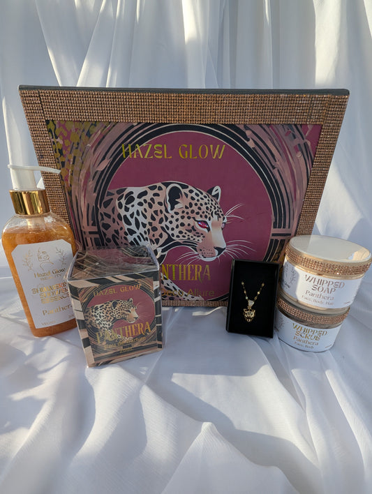 Collection of beauty products with 'Hazel Glow' branding on a white fabric background