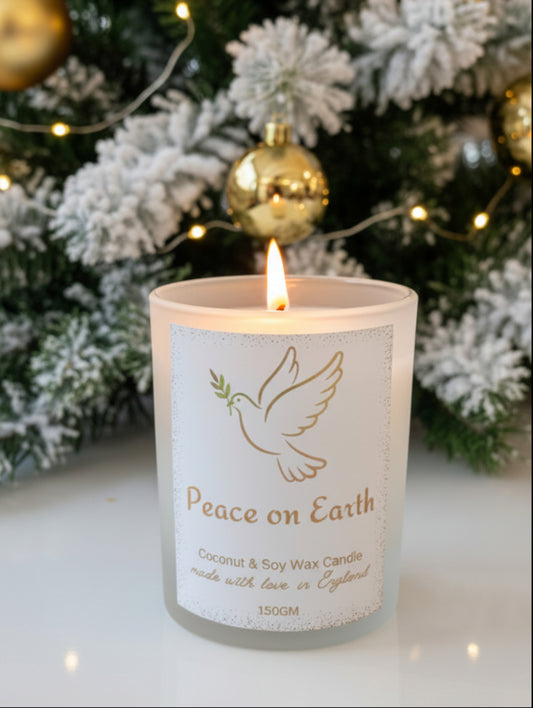 Christmas Candle Peace on Earth by Hazel Glow.  Frosted glass candle with gold or silver foiled label featuring a dove in flight holding an olive branch