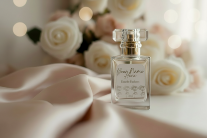 Personalised Perfume bottle with a customizable label against a soft floral background by Hazel Glow
