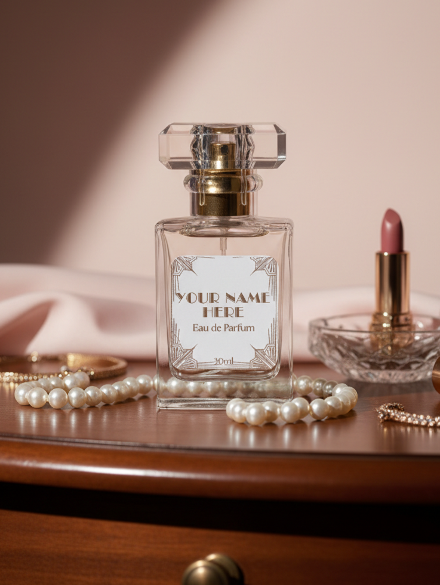 Perfume bottle with gold cap and customizable label on a white background