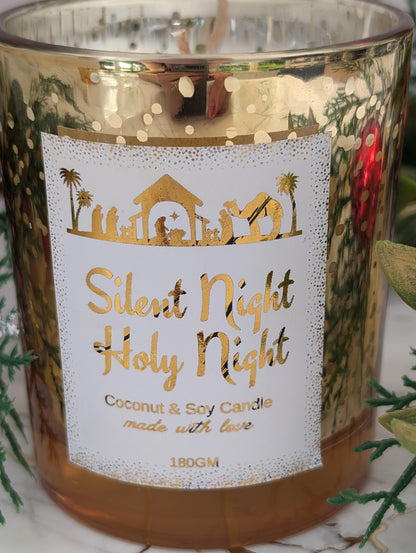 Candle with 'Silent Night Holy Night' label and decorative elements