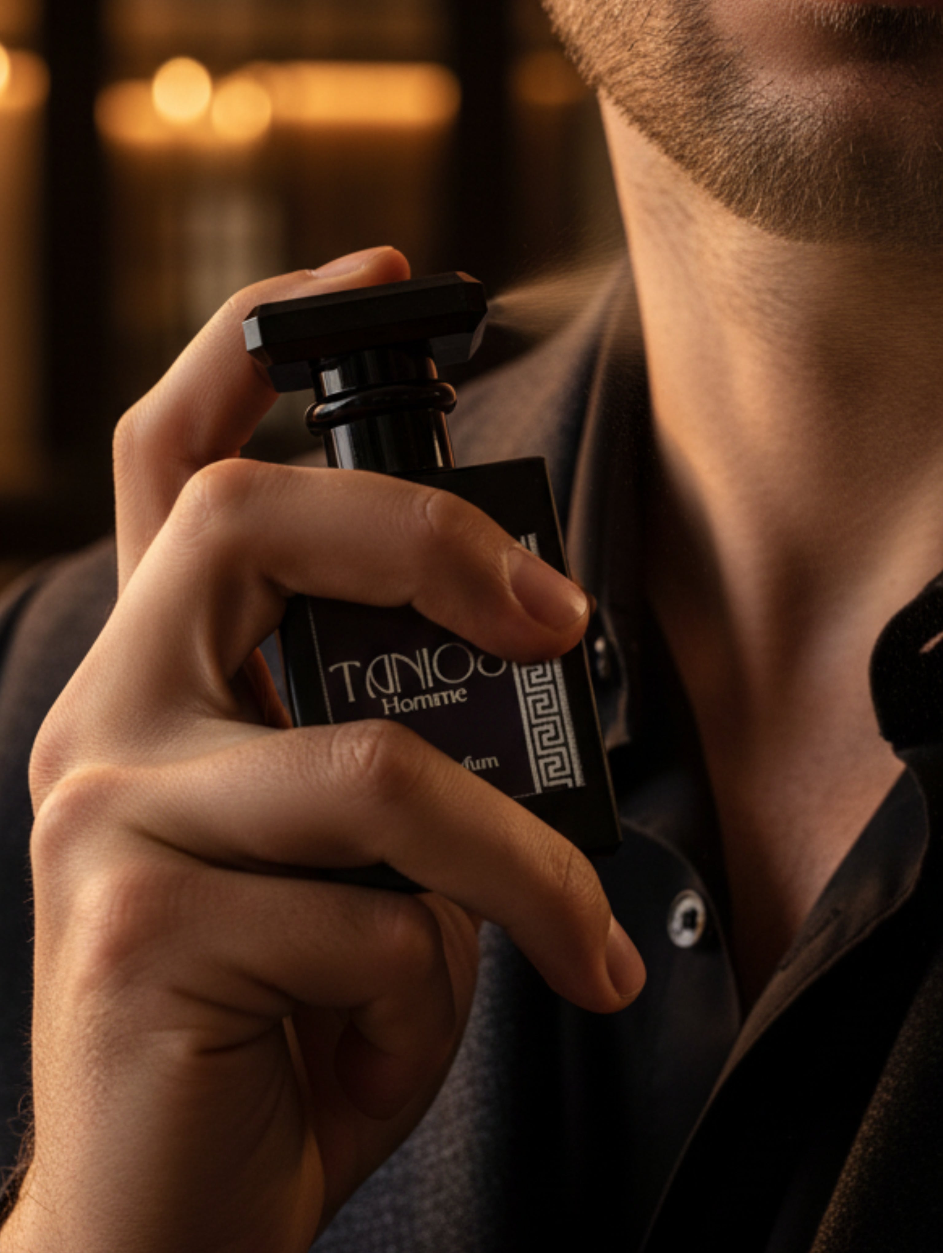Men's Perfume Tanios by Hazel Glow.  A 30ml bottle of Tanios Homme Eau de Parfum, featuring a matte black rectangular bottle with a dark purple label and a silver Greek key pattern on the right side.