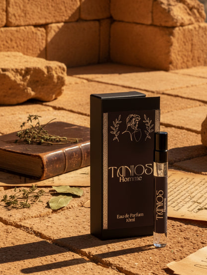 Men's Perfume Tanios Travel size for men by Hazel Glow.  On a rough stone floor with leather bound book and dried foliage