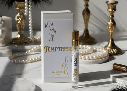 Temptress eau de parfum bottle and packaging on a marble surface