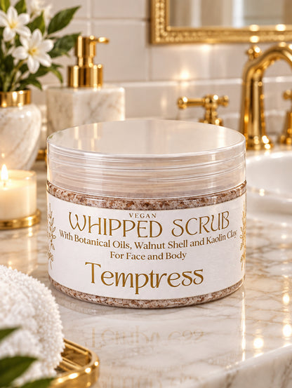 Jar of Temptress whipped scrub for women with walnut shell and botanical oils by Hazel Glow.  Shown in a luxury bathroom with gold fittings