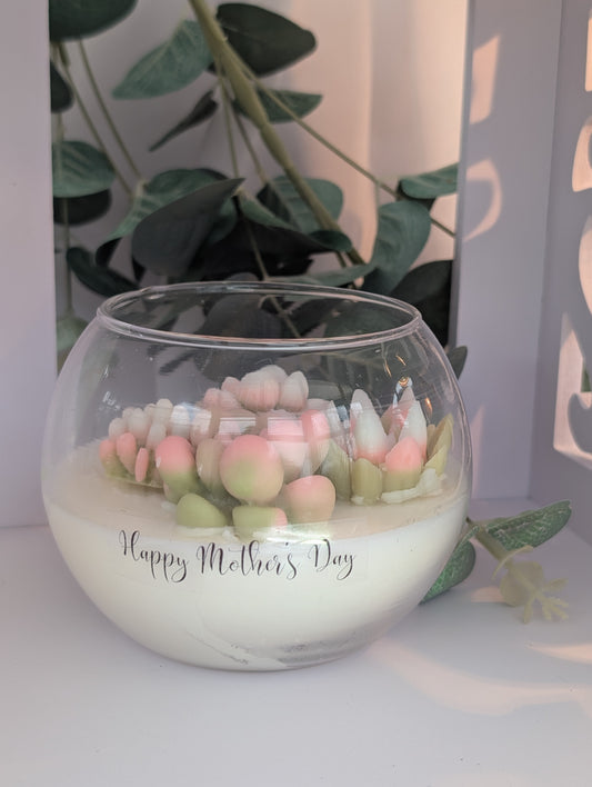 Best Mothers day gifts - beautiful hand poured vegan candle with hand poured hand coloured succulent decoration in clear glass fish bowl  shaped candle container with Happy Mother's Day clear 