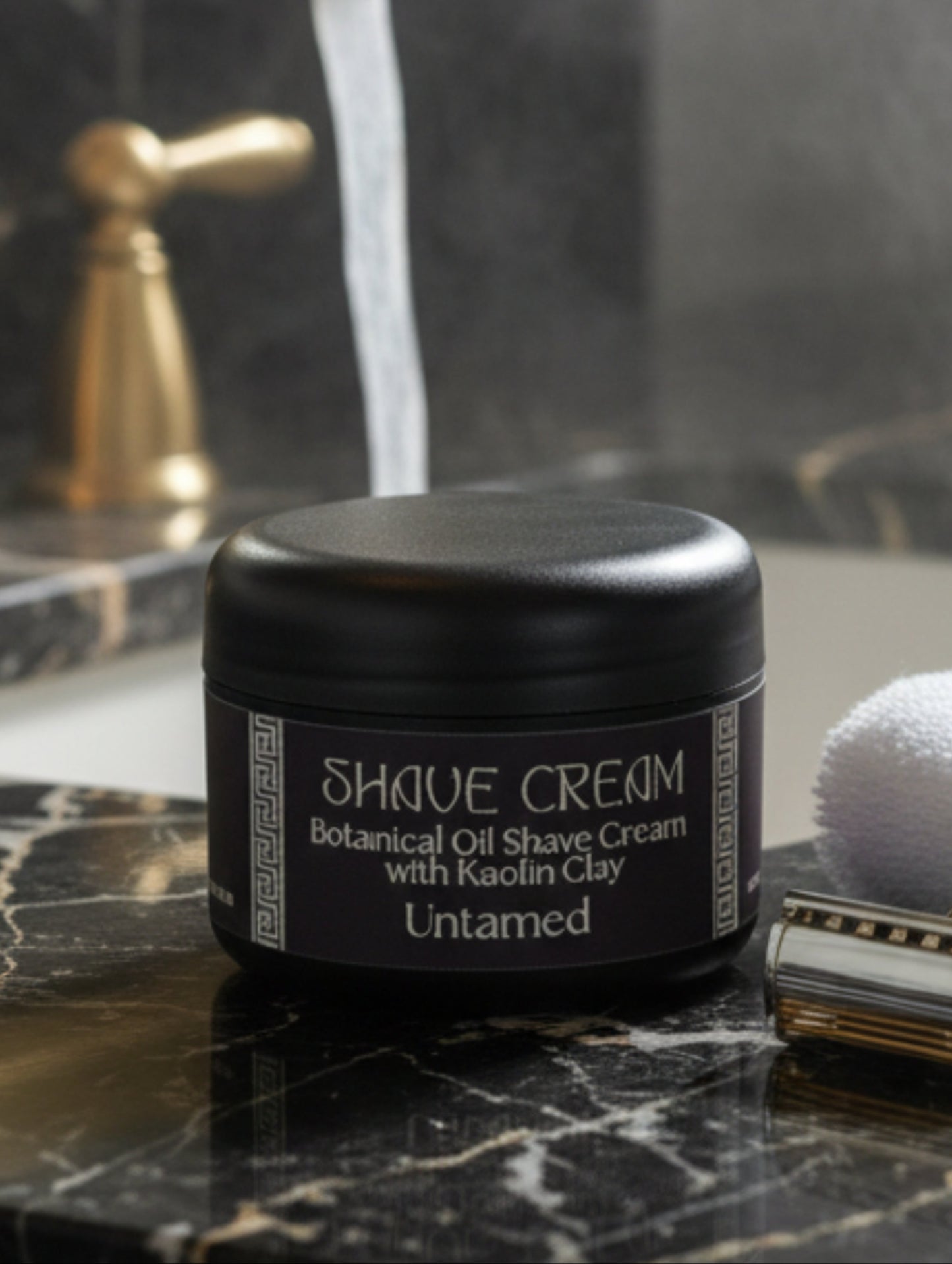 Shave Cream for Men - Untamed by Hazel Glow.  On black and white marble sink with gold taps in the background