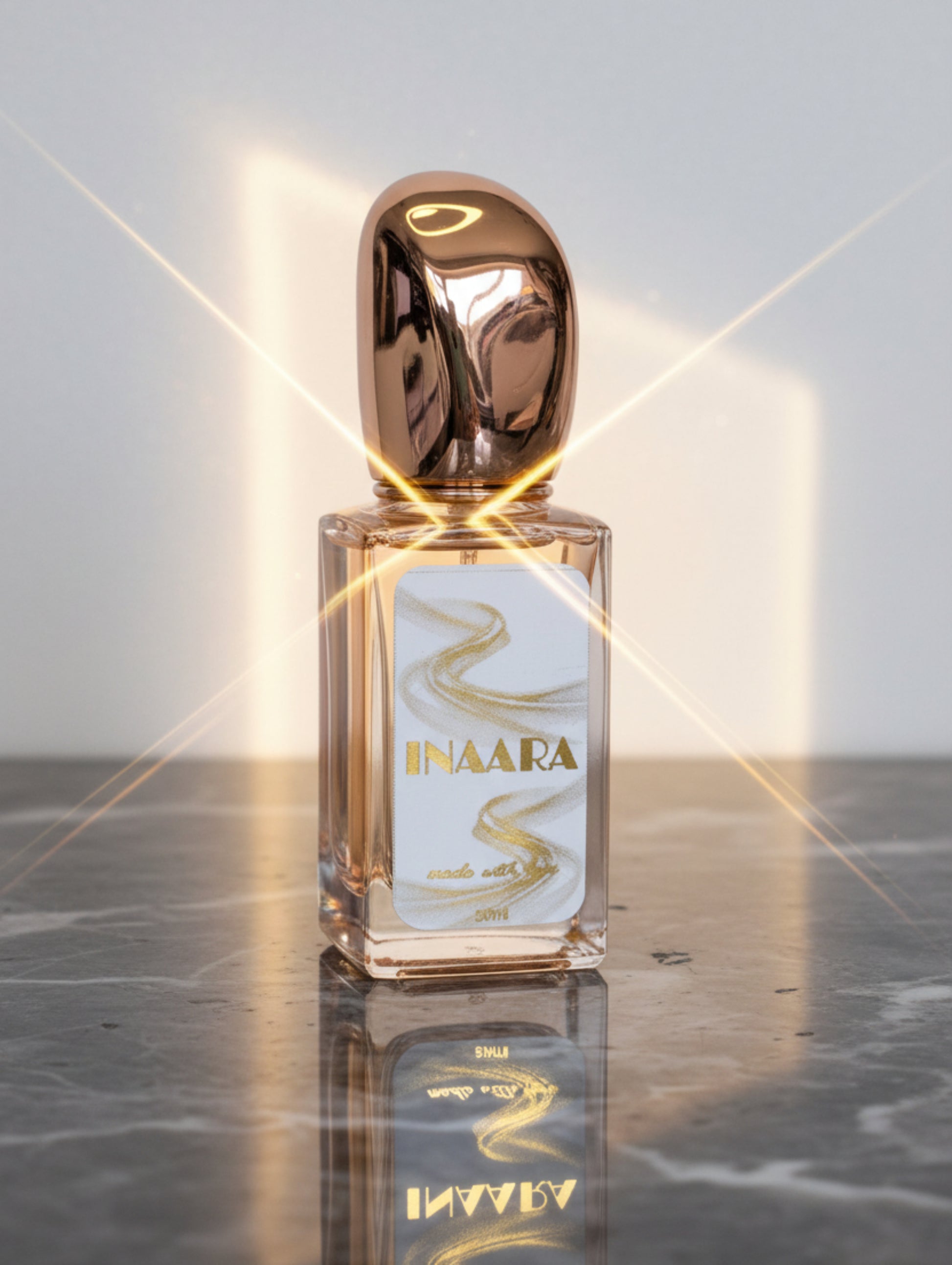 Vegan Perfume - Inaara, by Hazel Glow in rose gold bottle with sculptural rose gold metallic cap
