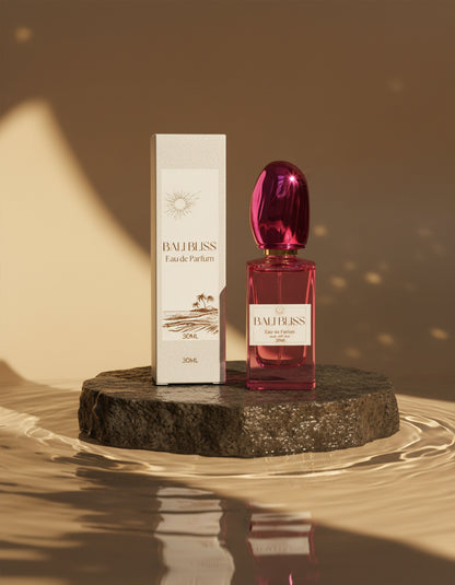 Vegan perfume, Bali Bliss by Hazel Glow.  Pink stylish bottle and box on a stone plinth in water