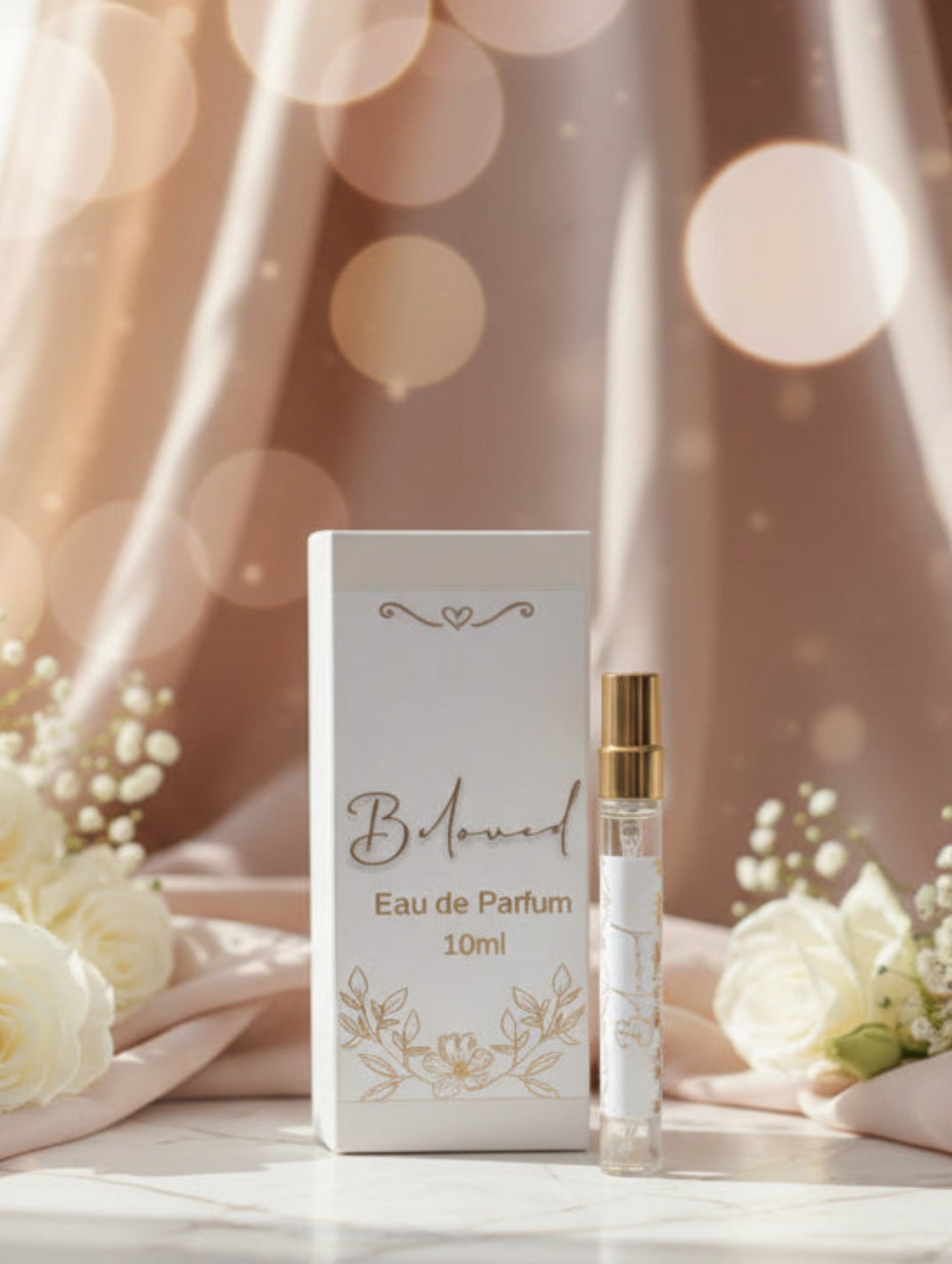 B. Marmont eau de parfum bottle and packaging with white roses on a soft background