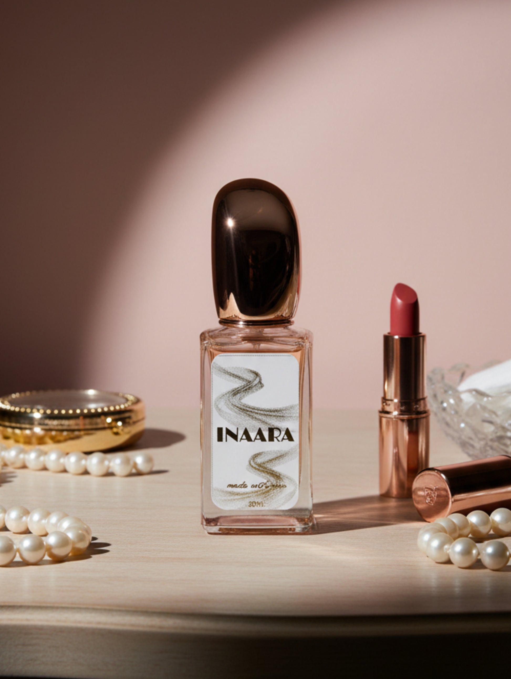 Inaara vegan perfume 30ml by Hazel Glow on  a dressing table with lipstick and pearls