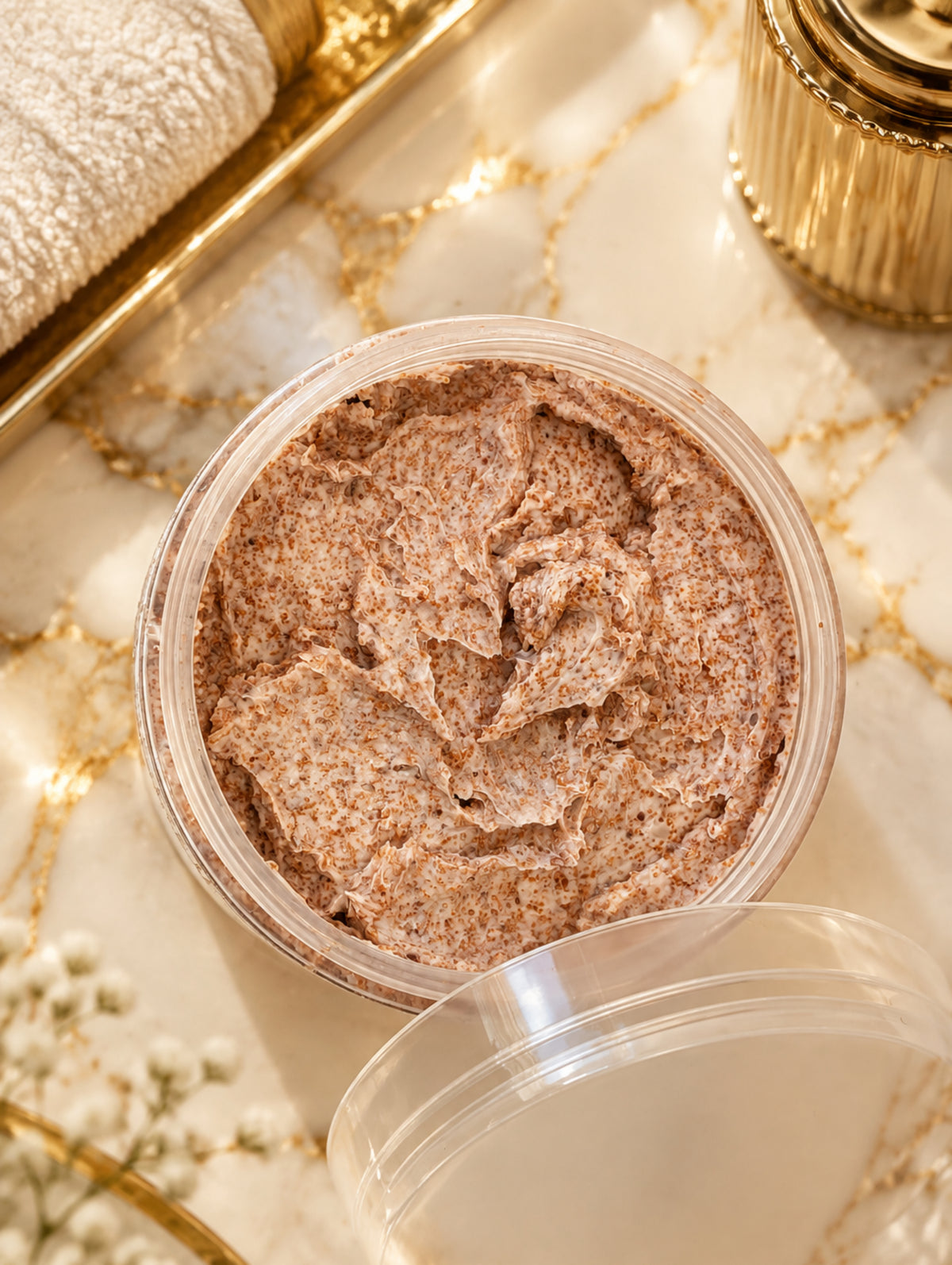 Open jar of Temptress Face and Body Scrub with botanical oils and walnut shell by Hazel Glow