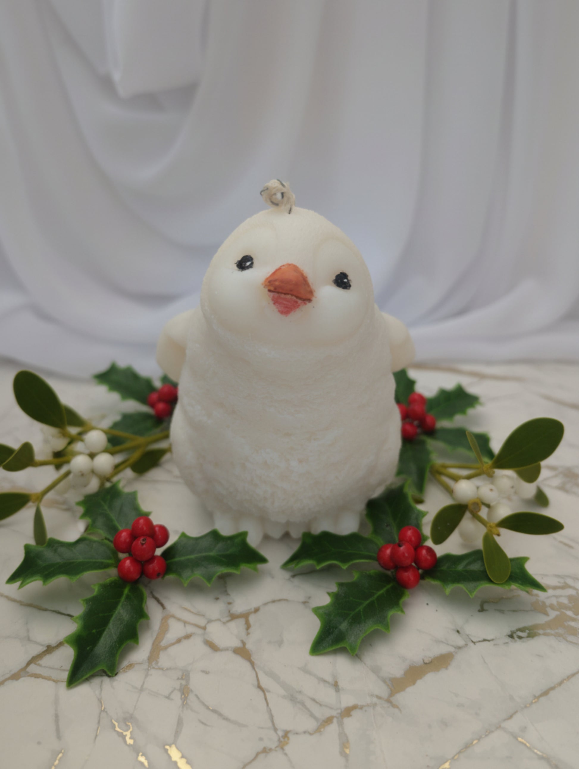 Cute Penguin Christmas Candle by Hazel Glow.  Eco friendly coconut and rapeseed wax handpainted beak and eyes