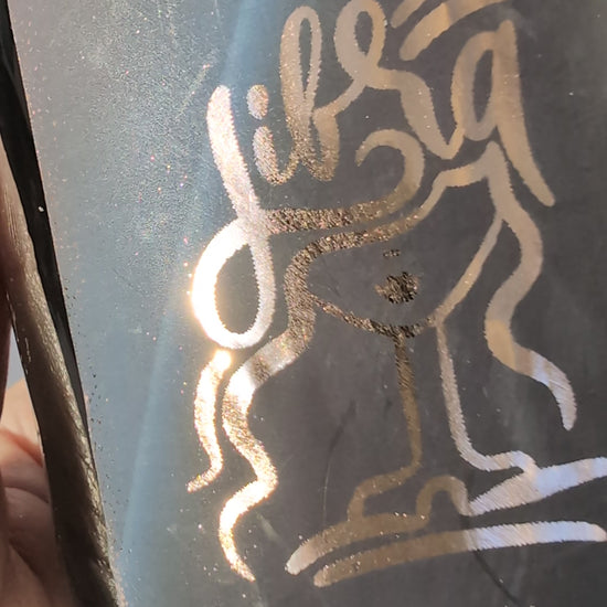 Gold foiled label detail on Libra zodiac candle